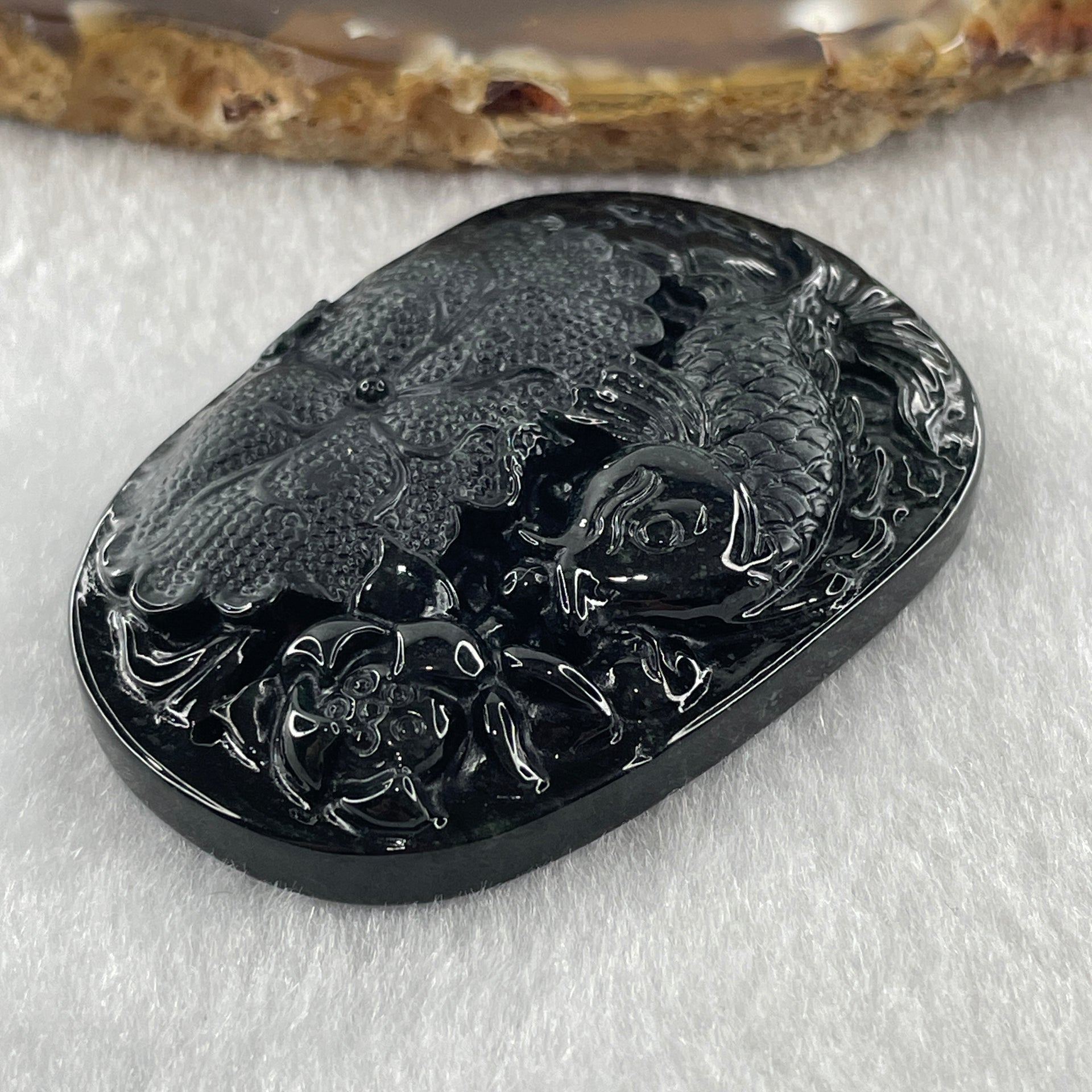 Type A Opaque to Partial Translucent Black Omphacite Jadeite Fish with Lotus Flower and Leaf Pendant 24.60g 51.1 by 35.9 by 8.8mm - Huangs Jadeite and Jewelry Pte Ltd