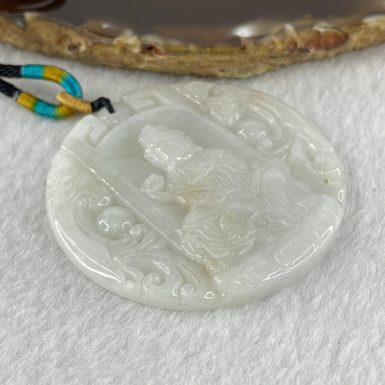 Natural Type A Faint Lavender Faint Green with Red Spots Jadeite Guan Yin Bodhisattva or Siṃhanāda Avalokiteśvara or Guanyin on Lion Roar Pendant 28.42g 51.0 by 5.6mm