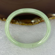 Type A Light Apple Green Jadeite Oval Bangle 33.35g Internal Diameter 52.3mm 12.2 by 6.5mm (Very Slight Fine Internal Lines) - Huangs Jadeite and Jewelry Pte Ltd
