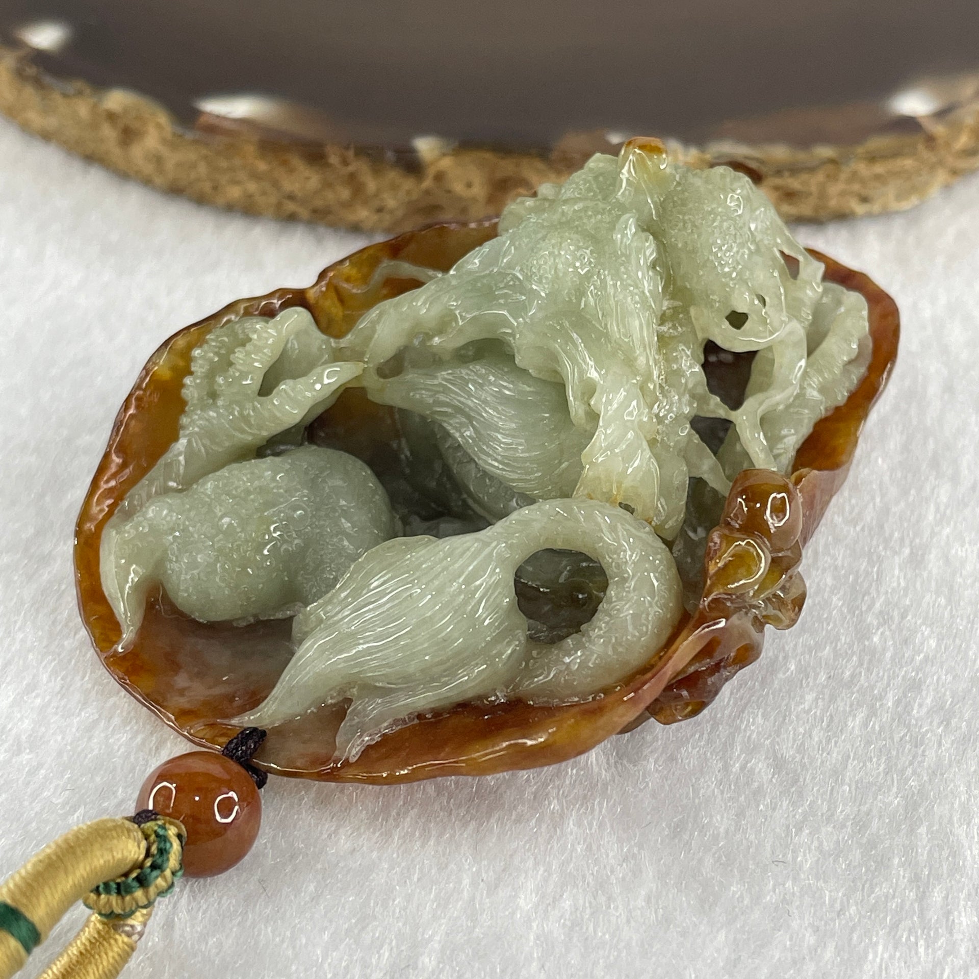 Type A Green with Brownish Jadeite Dragon Pendant 75.51g 68.8 by 49.5 by 28.9mm - Huangs Jadeite and Jewelry Pte Ltd