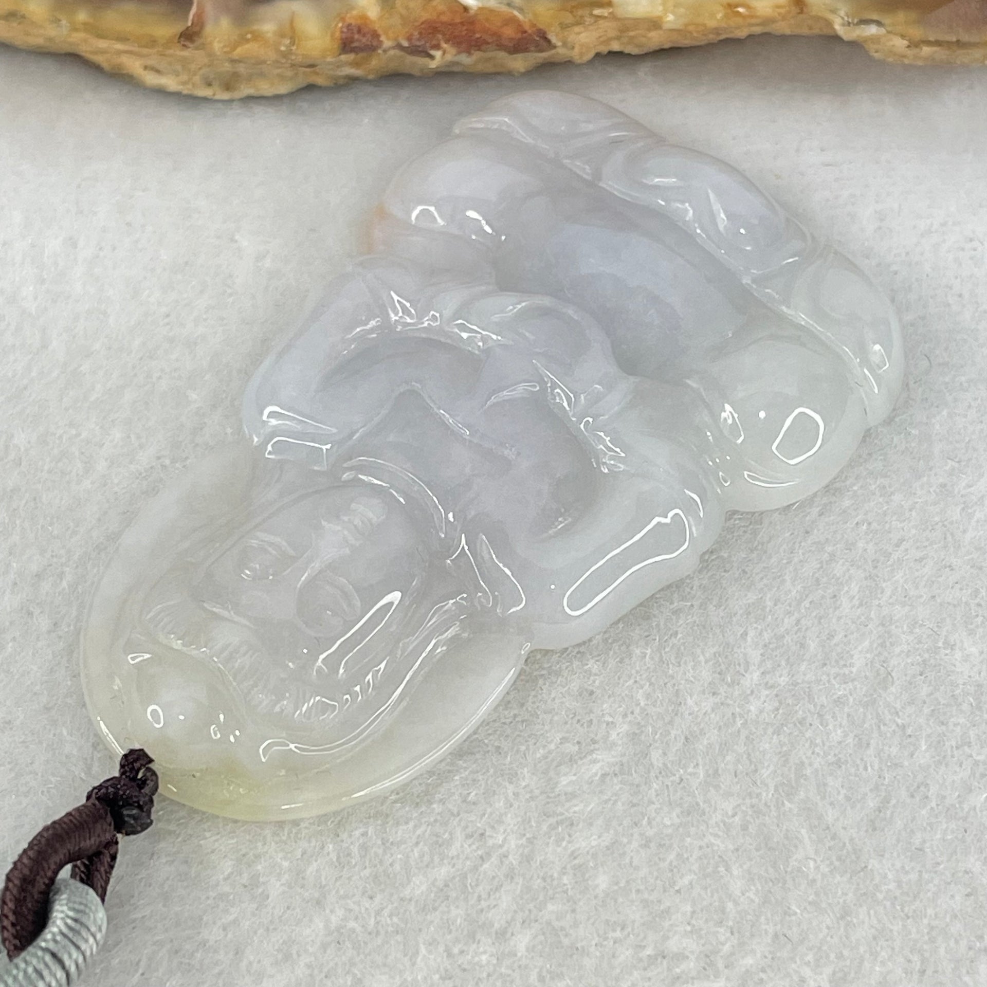 Type A Lavender Jadeite Guan Yin Pendant 16.26g 52.2 by 33.1 by 6.0mm - Huangs Jadeite and Jewelry Pte Ltd