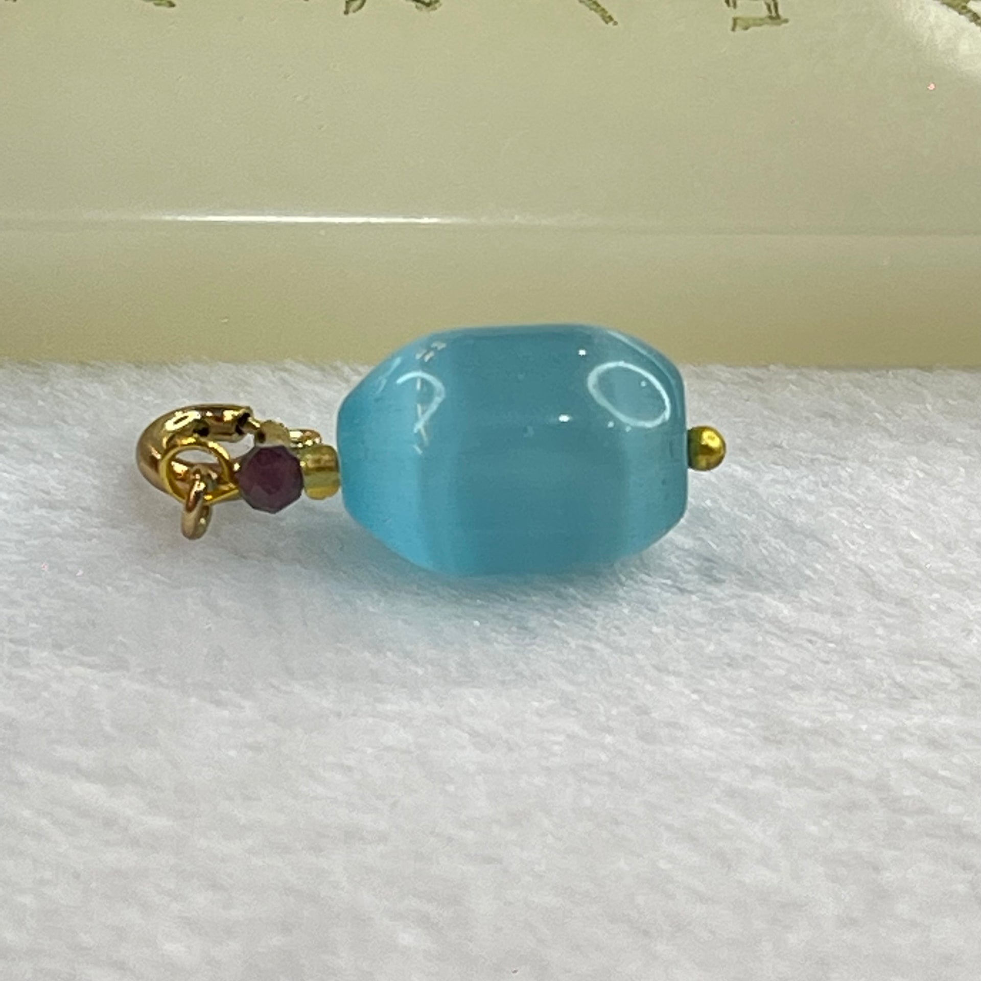 Blue Cat's Eye Glass Charm Pendent 2.31g 13.7 by 9.7mm - Huangs Jadeite and Jewelry Pte Ltd