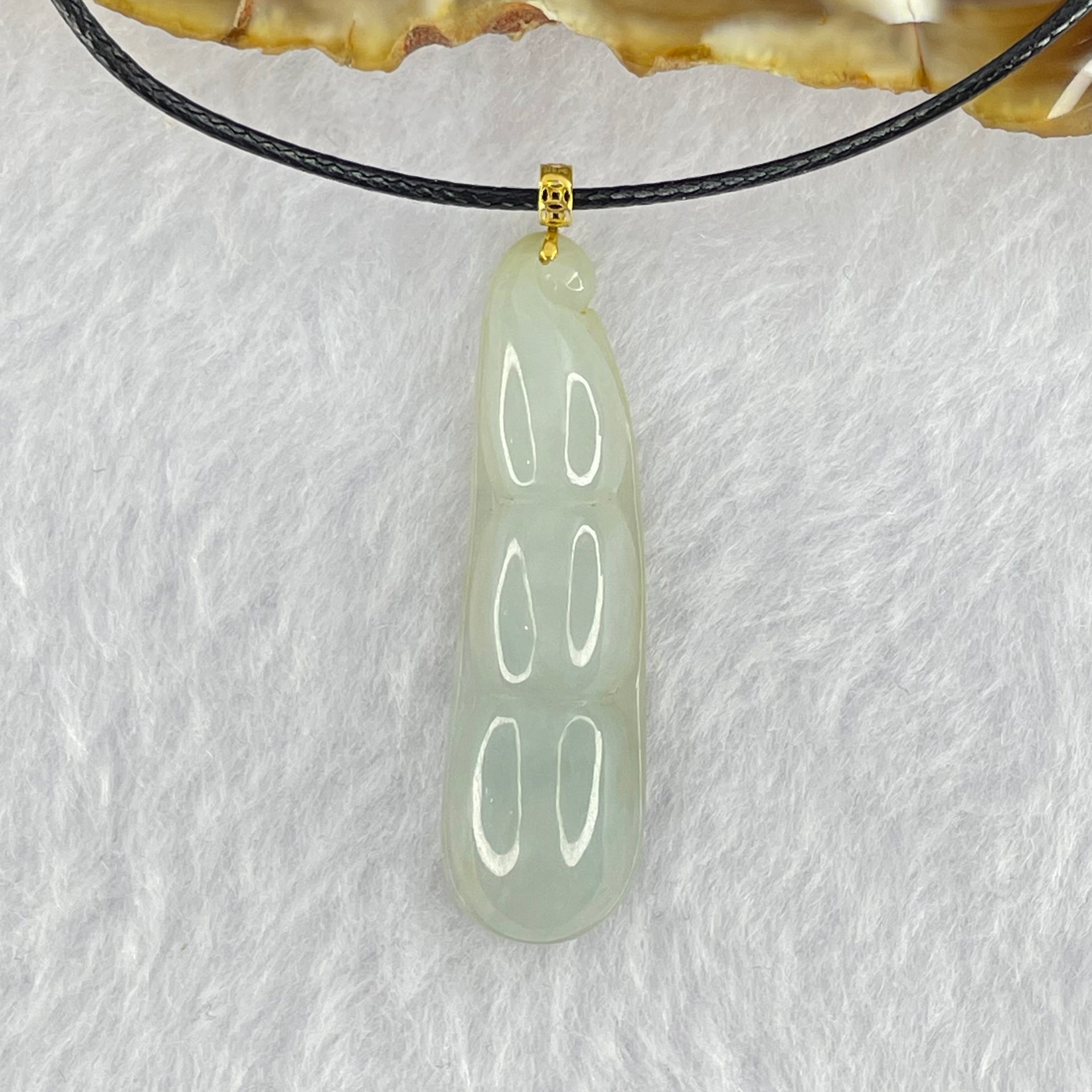 Type A Faint Green Jadeite Peapod Pendent 6.17g 39.1 by 11.3 by 7.1mm - Huangs Jadeite and Jewelry Pte Ltd