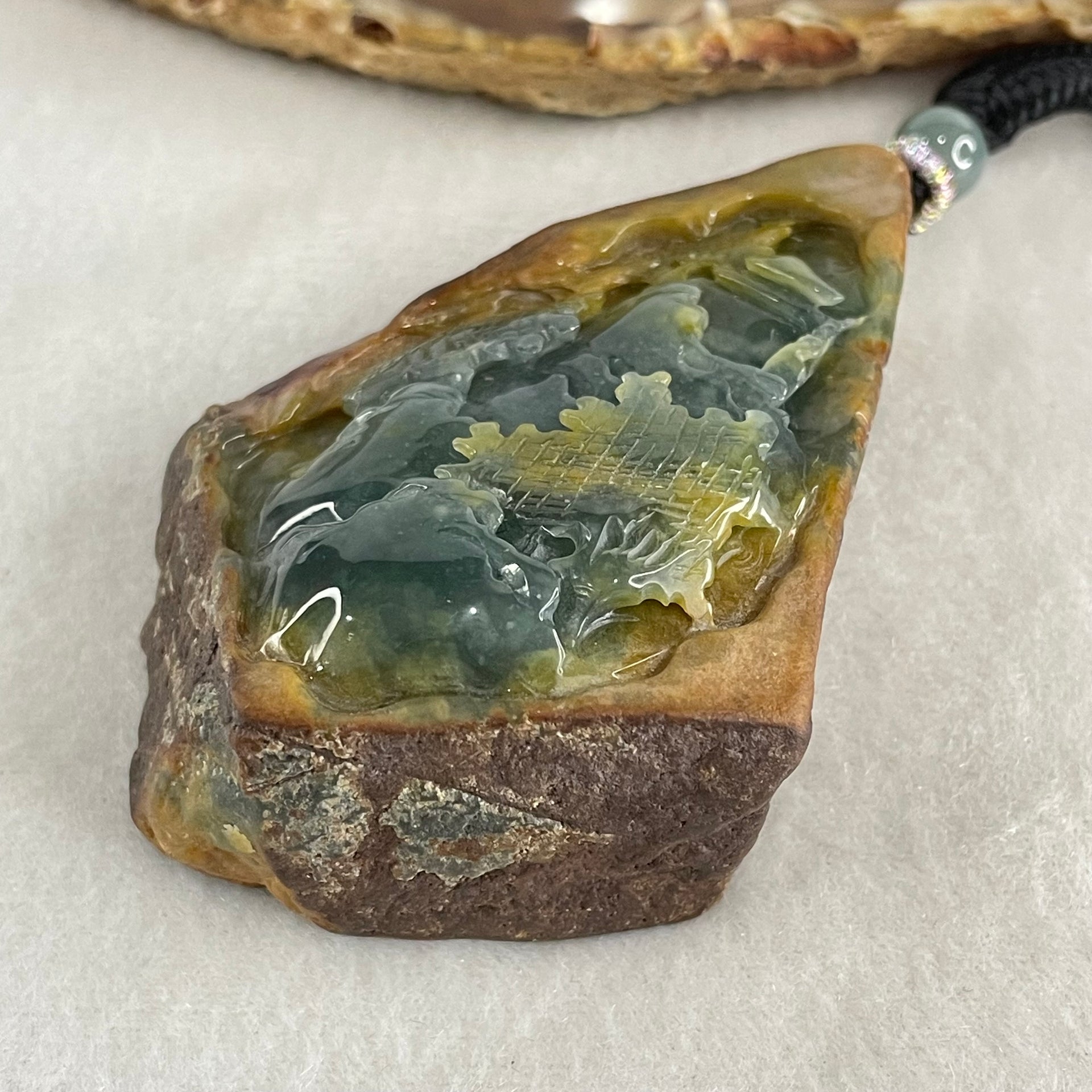 Grand Master Type A Brown with Blueish Green Jadeite Shan Shui with Guiren Benefactor Pendant 107.48g 74.0 by 53.9 by 23.3mm - Huangs Jadeite and Jewelry Pte Ltd