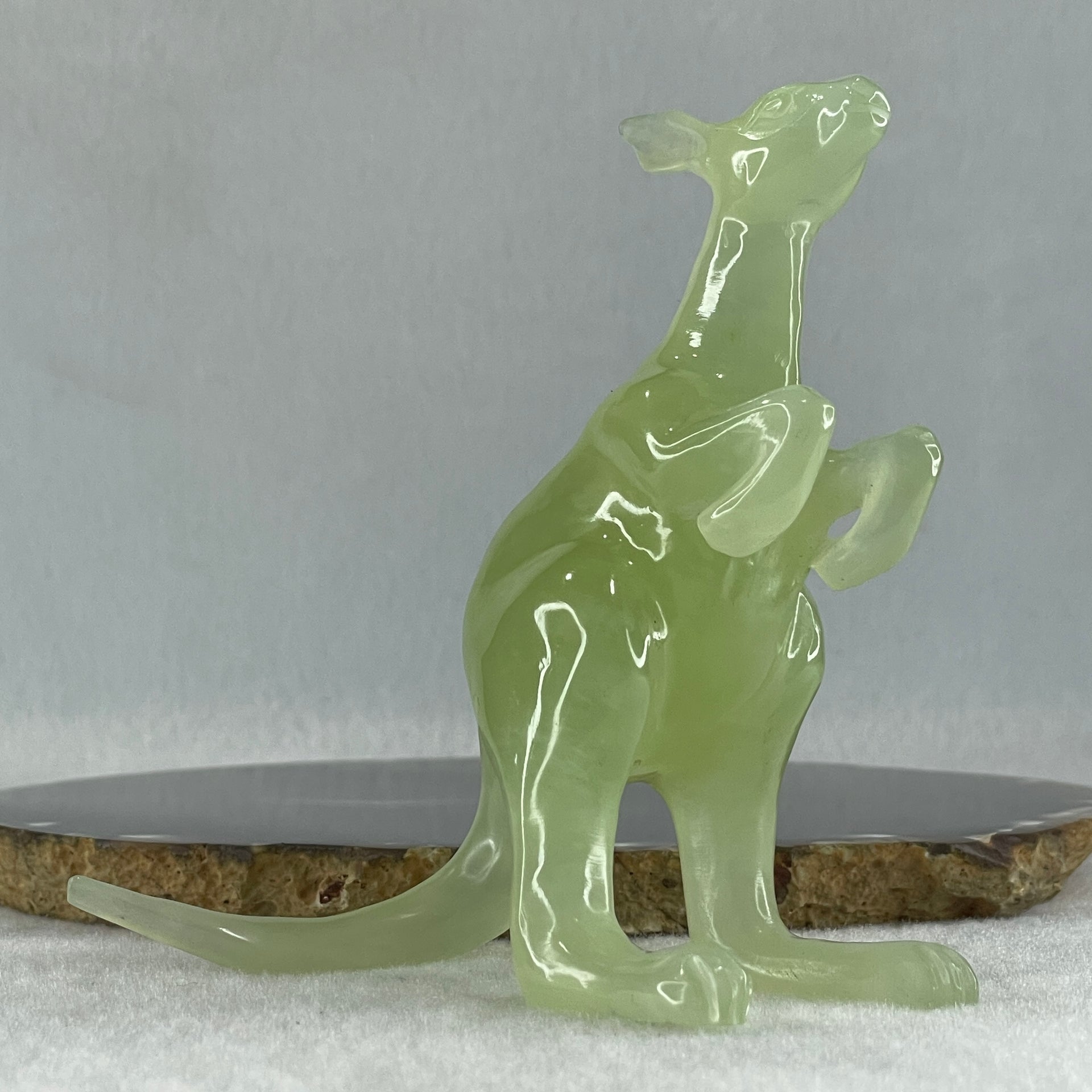 Natural Green Serpentine Kangaroo with Wooden Stand Display 172.6g 100.8 by 63.0 by 115.0mm - Huangs Jadeite and Jewelry Pte Ltd