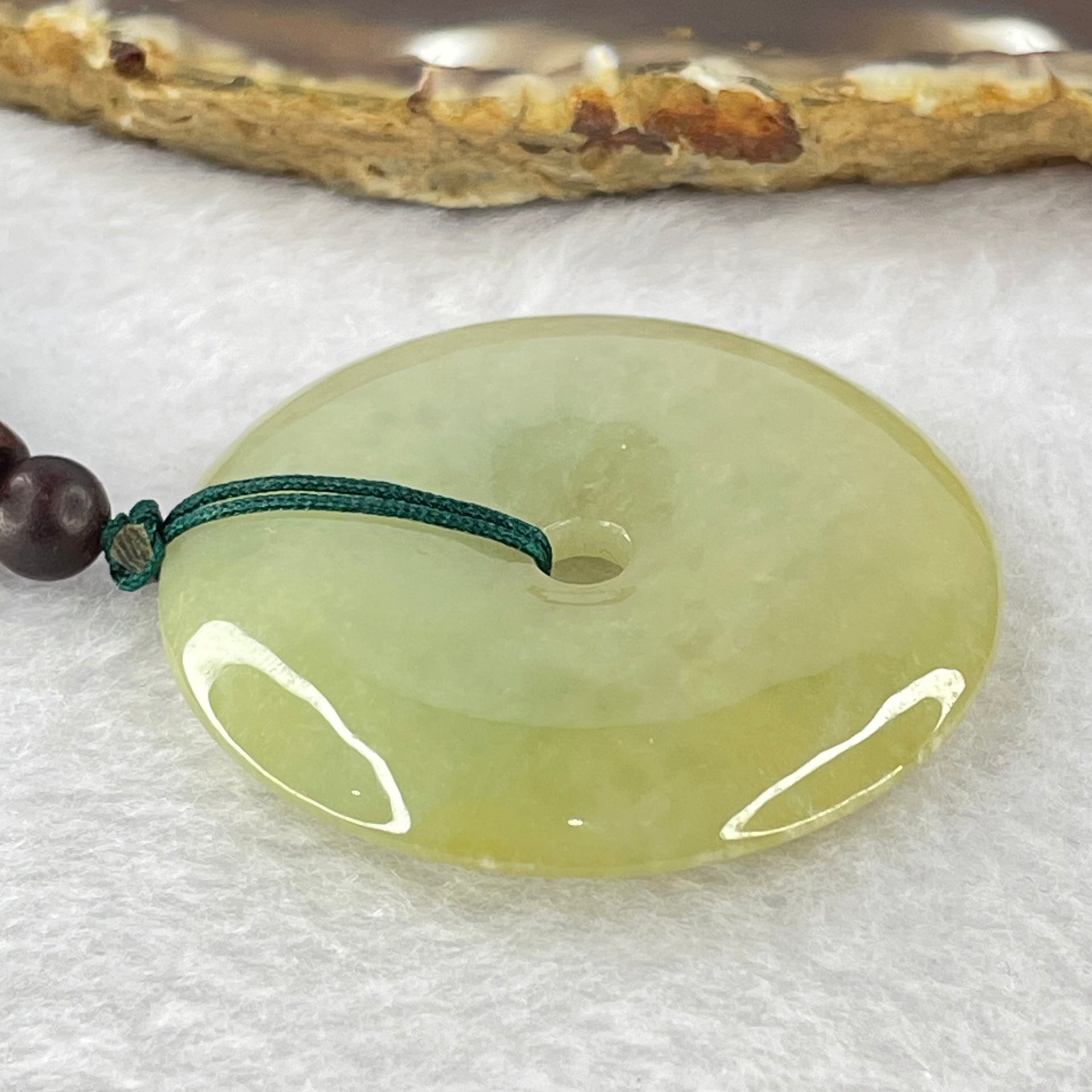 Type A Yellowish Green Jadeite Ping An Kou Donut Pendent 24.41g 43.0 by 7.1mm - Huangs Jadeite and Jewelry Pte Ltd