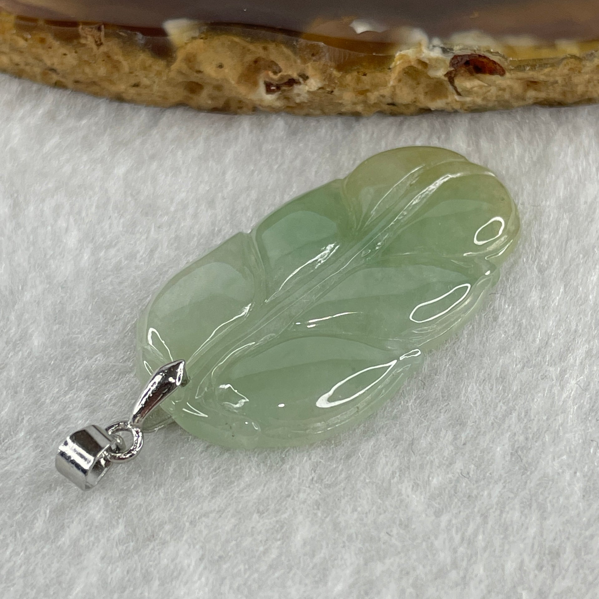 Natural Type A Semi Icy Light Green with Light Yellow Jadeite Prosperity Leaf Pendant in Silver Clasp Signifying Overnight Success 6.55g 38.4 by 21.6 by 4.0mm - Huangs Jadeite and Jewelry Pte Ltd