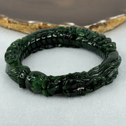 Type A Translucent to Opaque Old Mine Spicy Green Jadeite Dragon Bangle Internal Diameter 56.30mm 374.20cts 74.75g 16.0 by 12.5mm With NGI Cert 32885979 (Slight Internal Lines) - Huangs Jadeite and Jewelry Pte Ltd