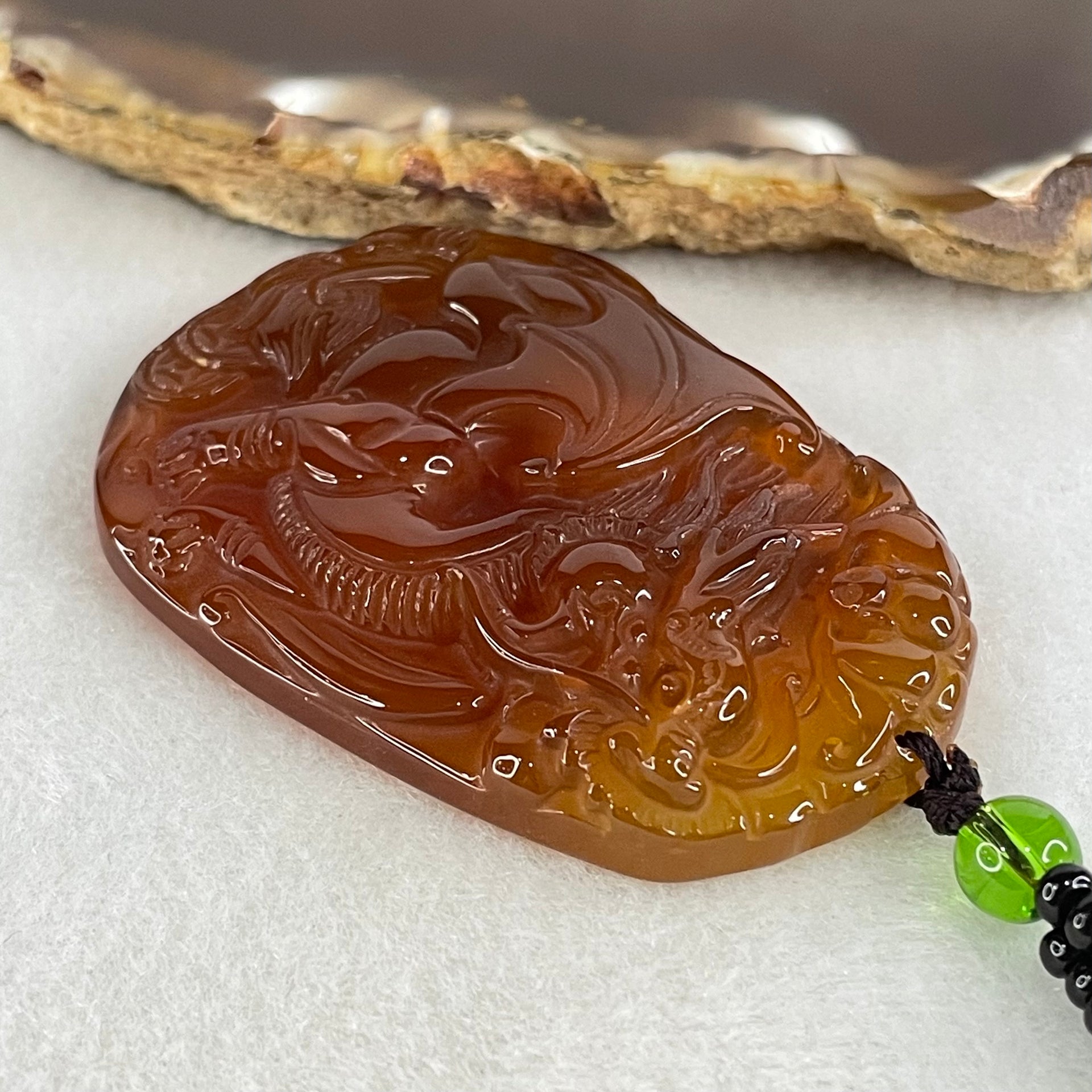 Natural Brownish Red Chalcedony Dragon Pendant 27.687g 54.1 by 38.5 by 9.1mm in Crystal Necklace 65cm - Huangs Jadeite and Jewelry Pte Ltd