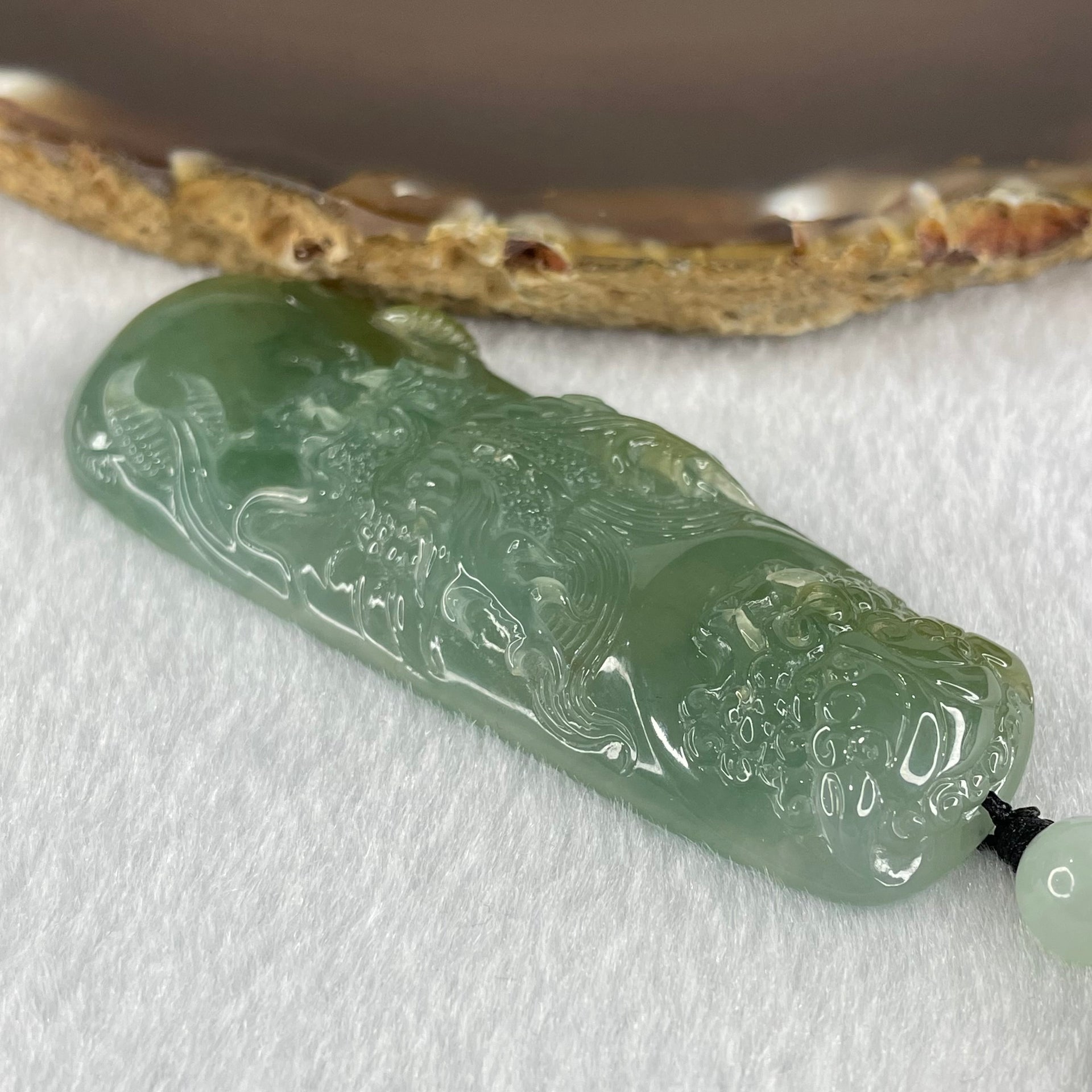 Grandmaster Type A Icy Blueish Green Jadeite Fu Gou on Dragon Pendant 30.95g 68 by 25 by 9.3mm - Huangs Jadeite and Jewelry Pte Ltd