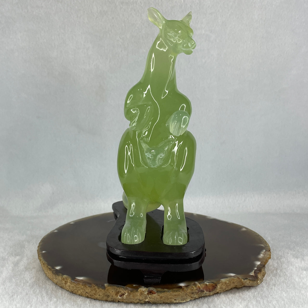 Natural Green Serpentine Kangaroo with Baby with Wooden Stand Display 382.2g 119.5 by 63.0 by 159.0mm - Huangs Jadeite and Jewelry Pte Ltd