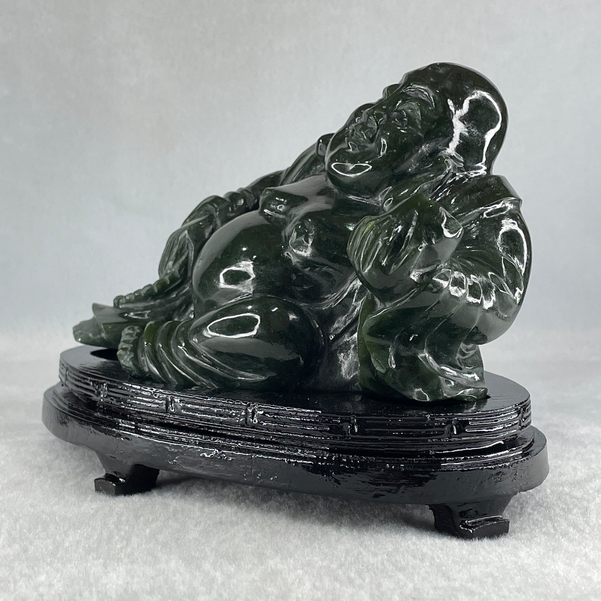 Natural Dark Green Serpentine Laughing Milo Buddha with Wealth Pot with Wooden Stand Display 1,656.6g 190.0 by 133.0 by 127.0mm - Huangs Jadeite and Jewelry Pte Ltd
