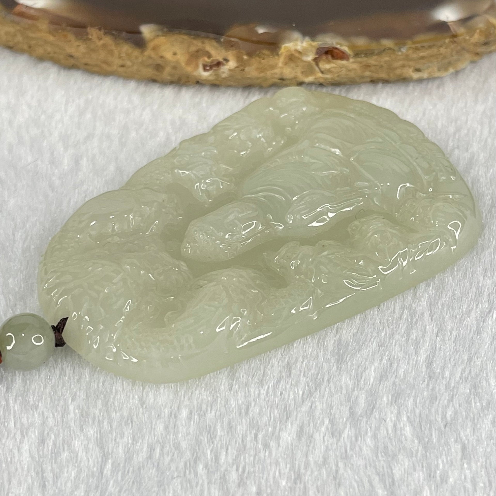Type A Semi Icy Light Green Jadeite Buddha with 9 Dragons Pendant 27.39g 57.6 by 39.0 by 6.4mm - Huangs Jadeite and Jewelry Pte Ltd
