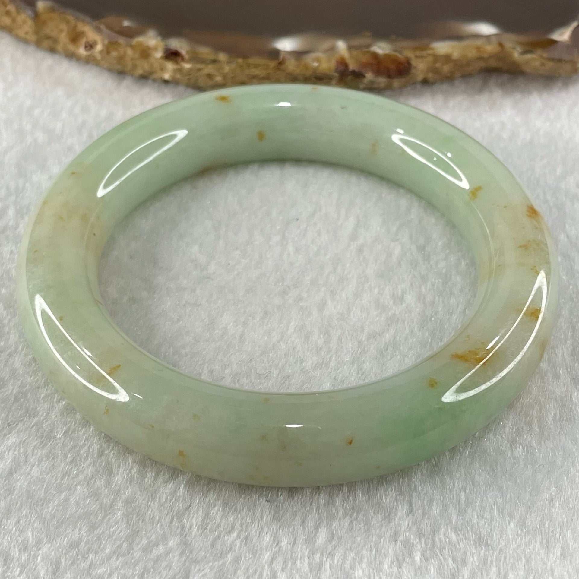 Type A Light Apple Green with Brownish Red Patches Jadeite Bangle 69.71g Internal Diameter 52.8mm 12.4 by 11.0mm (Close to Perfect) - Huangs Jadeite and Jewelry Pte Ltd