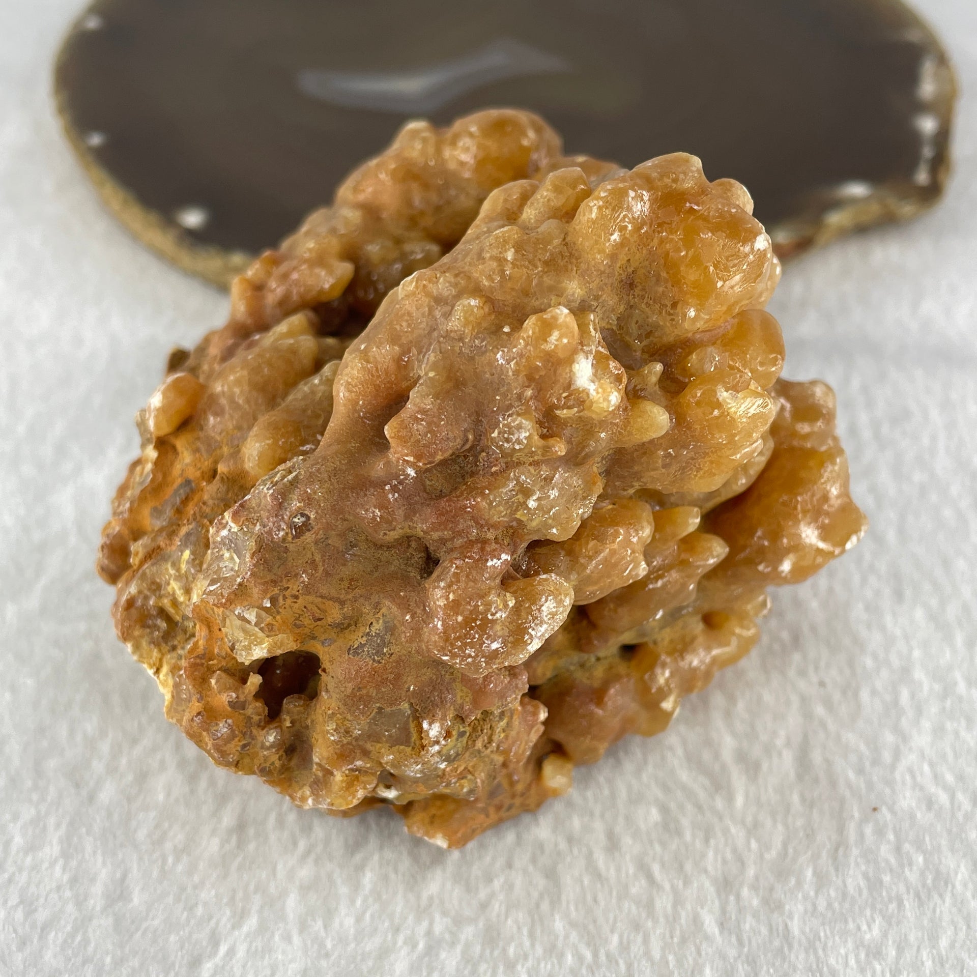 Natural Orange Calcite Rough Display with Wooden Stand 540.6g 109.7 by 94.1 by 123.0mm - Huangs Jadeite and Jewelry Pte Ltd