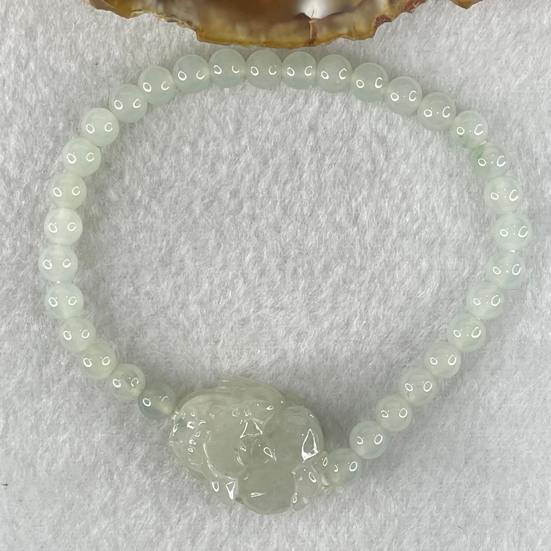 Special Type A Semi Icy Light Blueish Green Jadeite with Male Pixiu Charm Bracelet 5.61g 16cm 5.4mm 32 Beads 22.4 by 11.4 by 11.8mm 1pcs - Huangs Jadeite and Jewelry Pte Ltd
