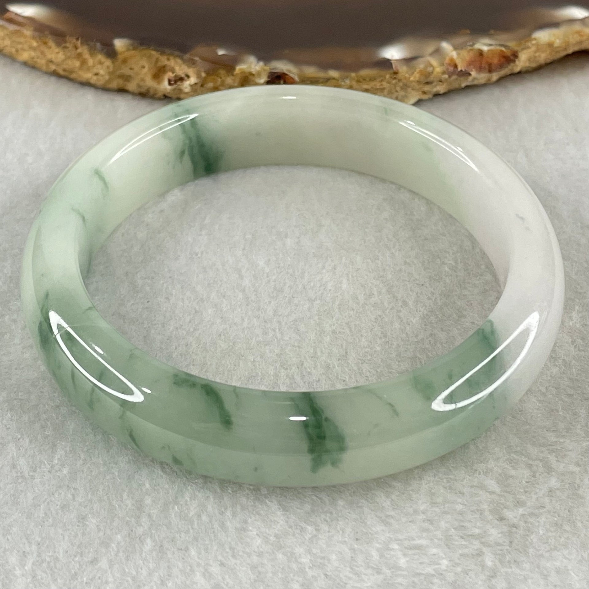 Type A Jelly Light Green with Blueish Green Piao Hua Floral Jadeite Bangle 55.51g Inner Diameter 56.3mm 12.6 by 8.4mm (Slight Internal Lines) - Huangs Jadeite and Jewelry Pte Ltd