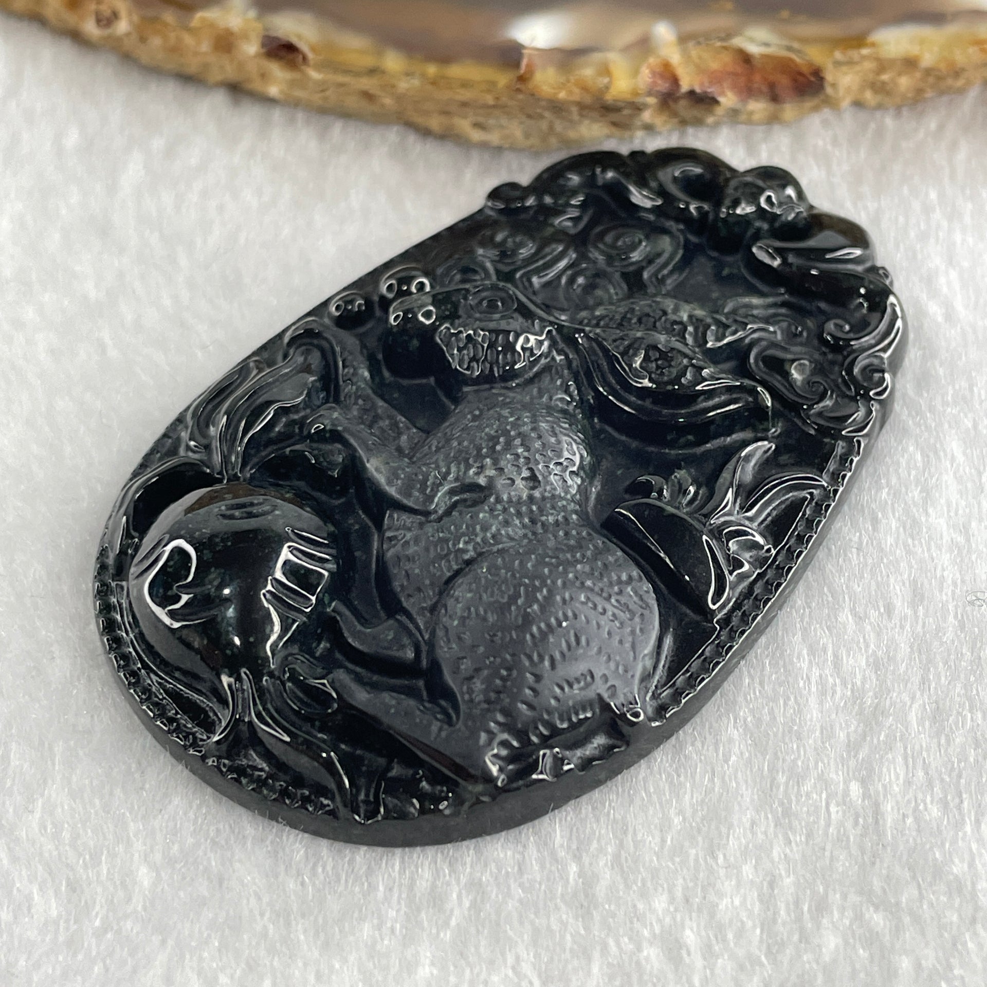 Type A Opaque to Partial Translucent Black Omphacite Jadeite Rabbit Pendant 25.89g 60.2 by 39.8 by 8.9mm - Huangs Jadeite and Jewelry Pte Ltd