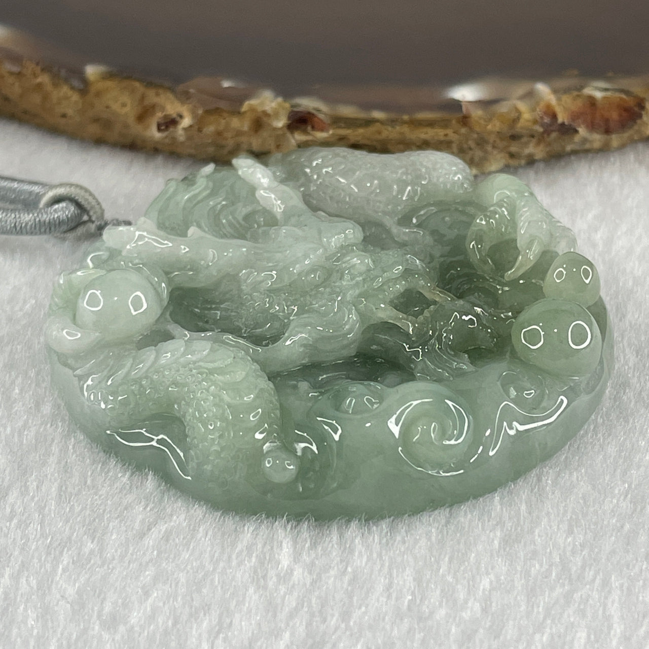 Type A Light Green with White Piao Hua Jadeite Dragon Double Side Pendant 62.04g 55.5 by 11.2mm