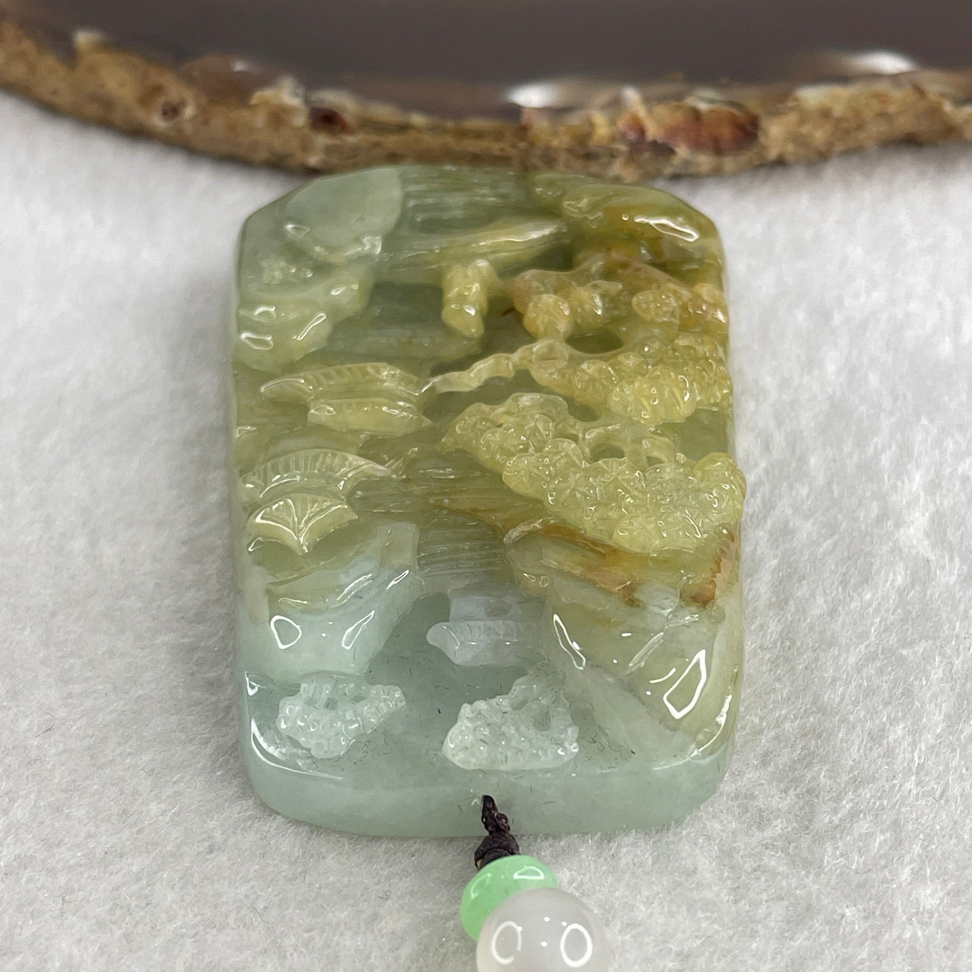 Natural Type A Yellowish Green with Sky Blue Jadeite Shan Shui with Gui Ren Benefactor Pendant 76.29g 67.4 by 43.0 by 12.0mm - Huangs Jadeite and Jewelry Pte Ltd