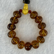 Natural Cognac Amber with Damo Head Handphone Strap 4.30g 7.6mm 13 Beads - Huangs Jadeite and Jewelry Pte Ltd