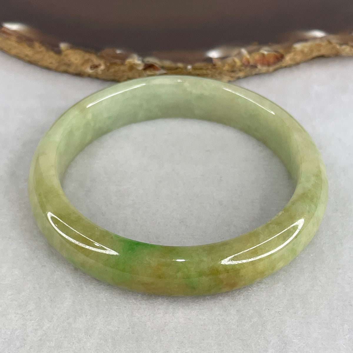 Natural Type A Jadeite Bangle | Green with Apple Green & Earthy Brown Piao Hua (49.36g | 55.8mm Inner Diameter | 12.5 x 8.0mm) (Slight External Rough)