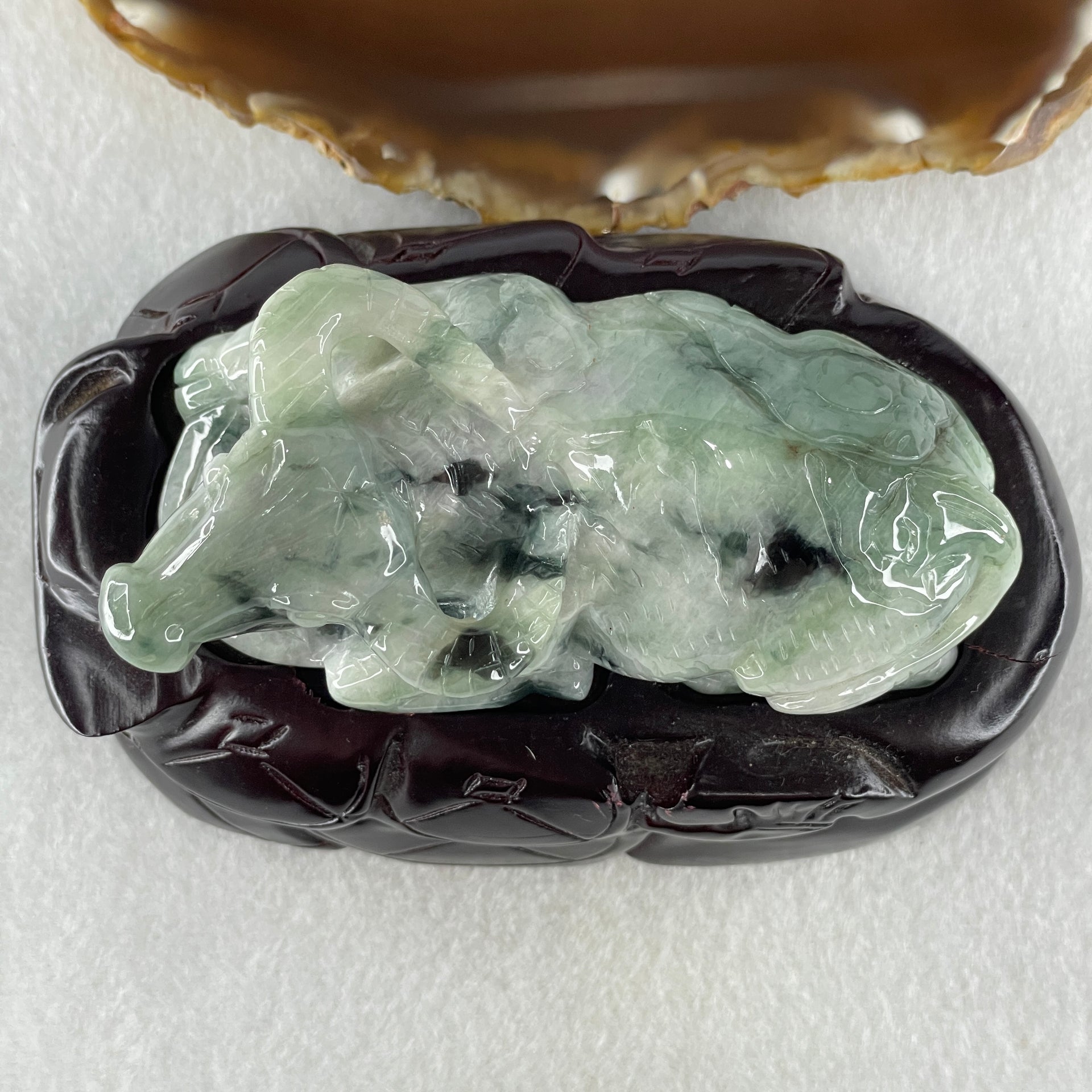 Natural Type A Light Green Light Lavender with Dark Green Patches Jadeite Ox with Wooden Stand Display 341.7g 116.5 by 73.9 by 66.0mm - Huangs Jadeite and Jewelry Pte Ltd