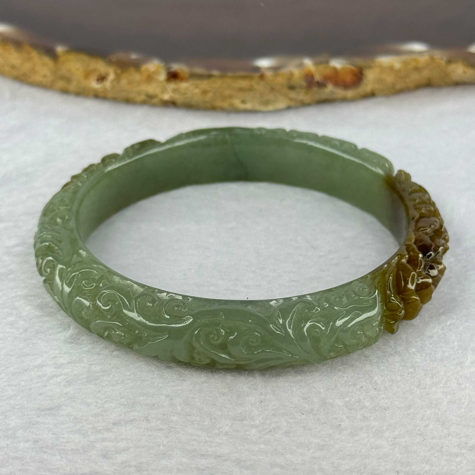 Type A Blueish Green and Brown Patches Jadeite Lotus Flowers Bangle 39.19g Internal Diameter 55.2mm 10.9 by 8.2mm - Huangs Jadeite and Jewelry Pte Ltd