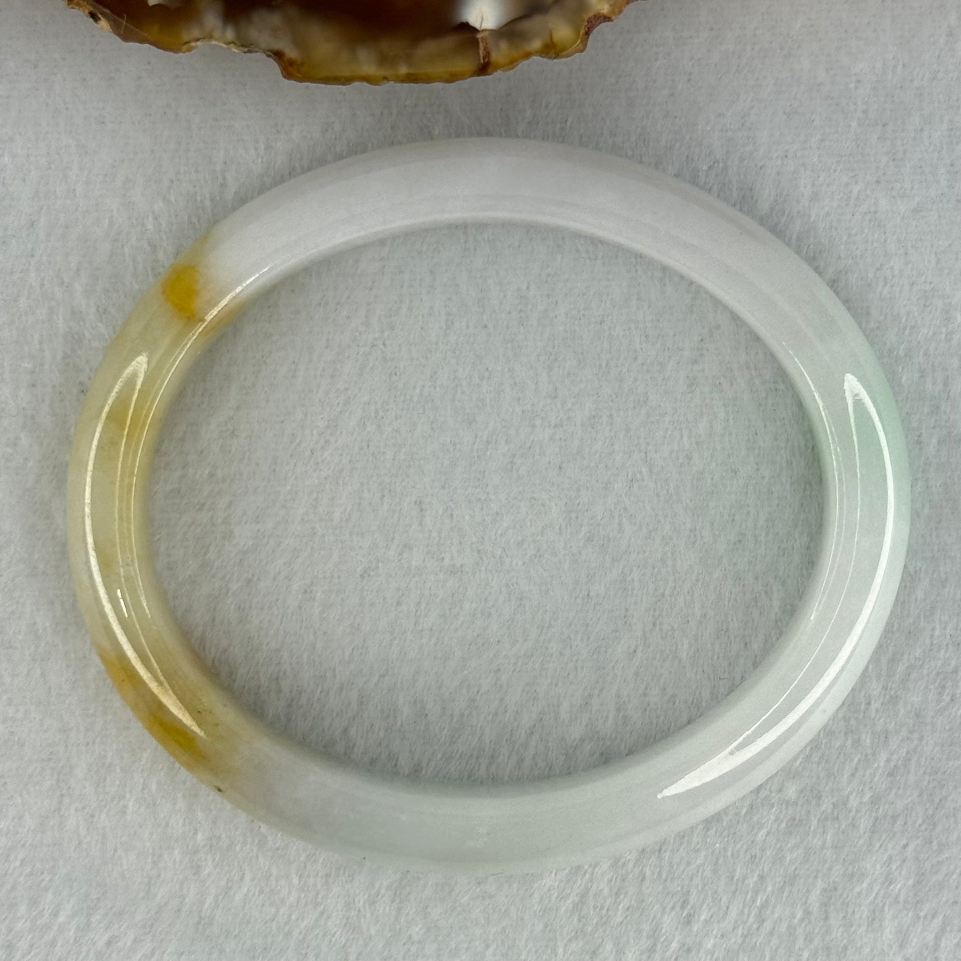 Type A Faint Lavender Green with Yellow Patches Jadeite Oval Bangle Internal Diameter 56.5mm  37.8696g 11.1 by 7.3mm (Very Slight Internal Line) - Huangs Jadeite and Jewelry Pte Ltd