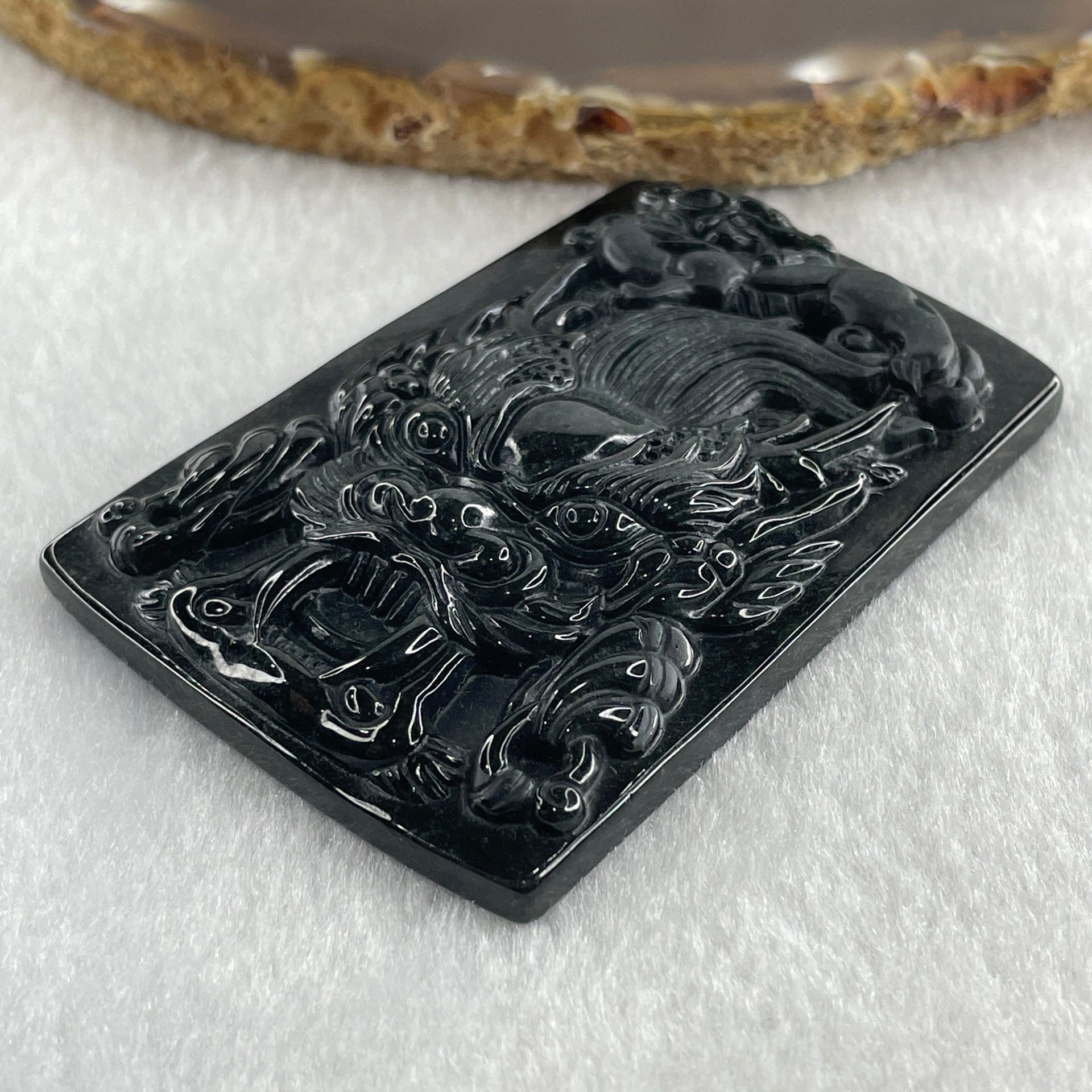 Type A Opaque to Partial Translucent Black Omphacite Jadeite Dragon with pixiu Pendant 45.42g 66.0 by 45.5 by 9.2mm - Huangs Jadeite and Jewelry Pte Ltd