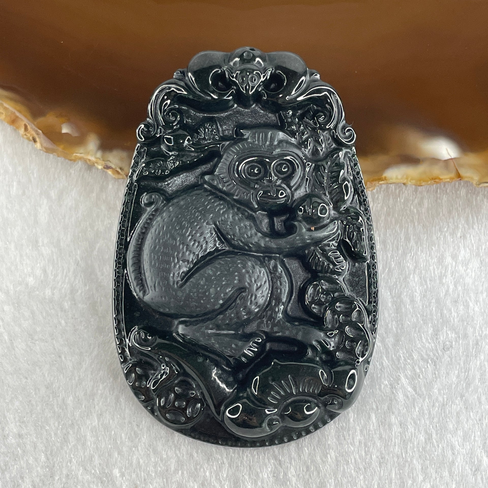 Type A Opaque to Partial Translucent Black Omphacite Jadeite Monkey Pendant 29.60g 59.6 by 40.1 by 8.5mm - Huangs Jadeite and Jewelry Pte Ltd
