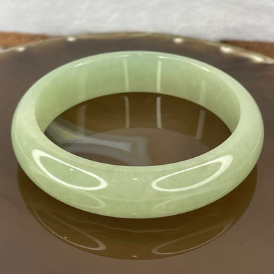 Type A green jadeite bangle 60.83g Inner diameter 58.37mm by 14.8 by 7.5mm (close to perfect) with NGI cert - Huangs Jadeite and Jewelry Pte Ltd