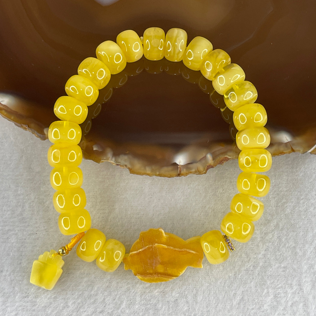 Natural Butterscotch Amber Donut Beads with Fish Charm Bracelet 13.93g 10.4mm 25 Beads - 24.8 by 16.5 by 5.3mm Fish
