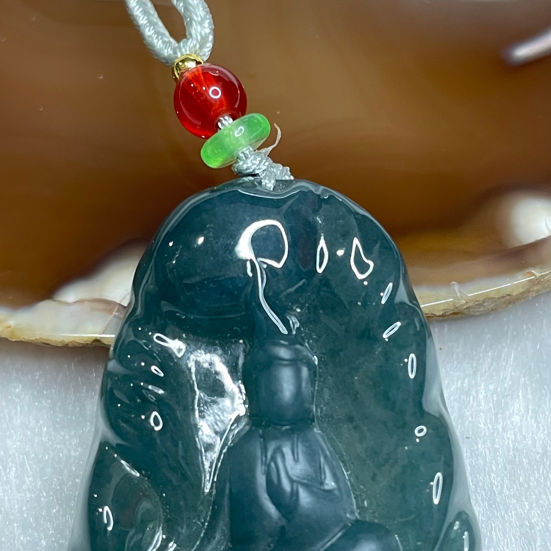 Type A Blueish Green Guan Yin Jade Jadeite 19.79g 46.2 by 30.0 by 7.5mm - Huangs Jadeite and Jewelry Pte Ltd